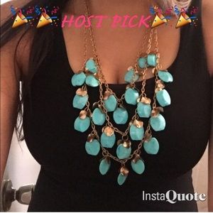 Statement necklace turquoise/gold colored.
