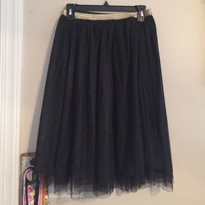 black flowy skirt with gold waistband