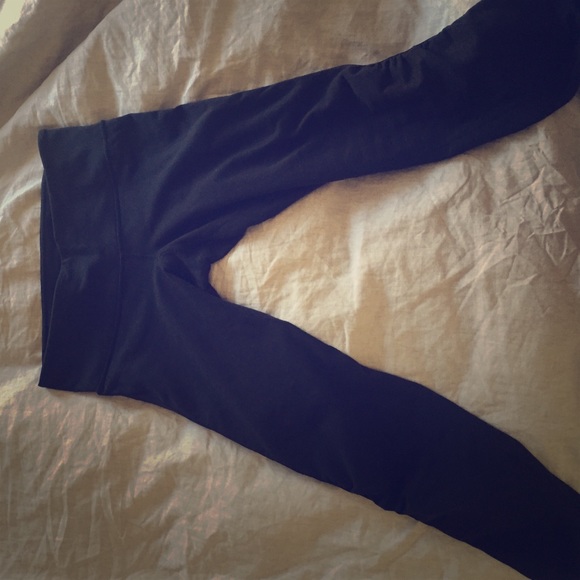 Black LuLulemon tights with tuxedo stripe.