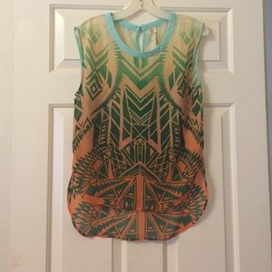Sheer blouse with green and orange coloring.