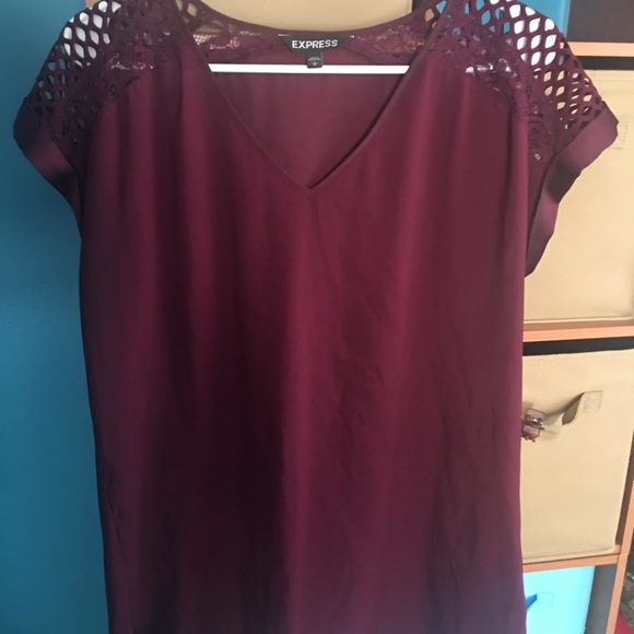 express top with detailed sleeves.