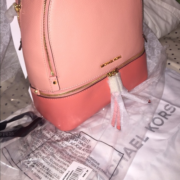Leather/medium/peach/unused.Michaelkors backpack.