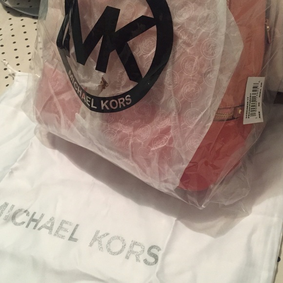 Leather/medium/peach/unused.Michaelkors backpack.