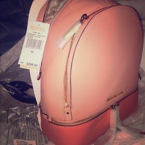 Leather/medium/peach/unused.Michaelkors backpack.