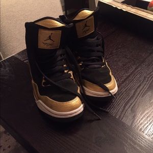 Gold and Black Nike Air Jordans, "Jump Man".