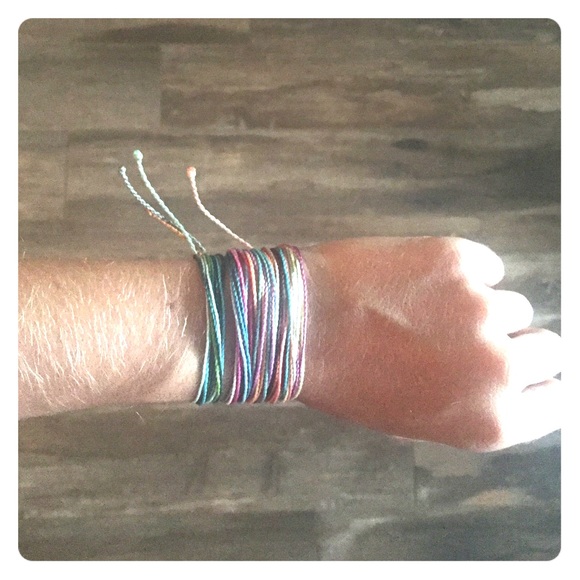 5 Pura Vida bracelets.