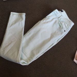 Light wash mint skinny jeans