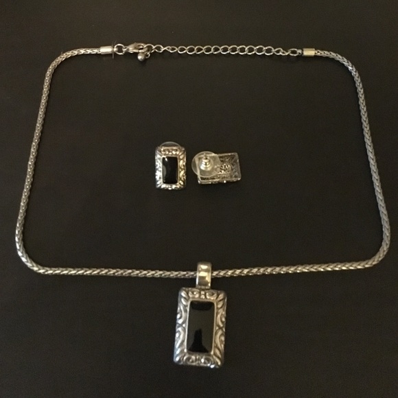 Silver tone earrings & necklace with black accent.