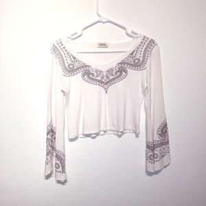 Cream midriff top with bell sleeves