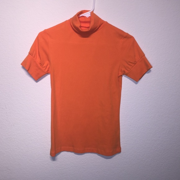 Turtle neck orange tee shirt with puffed sleeves