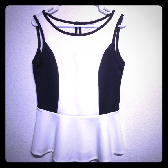 Sleeveless white and black peplum top
