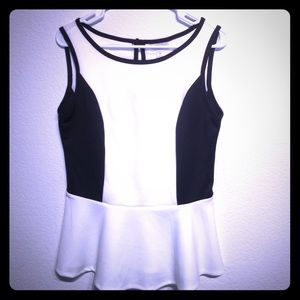 Sleeveless white and black peplum top