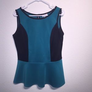 Sleeveless green and black peplum top
