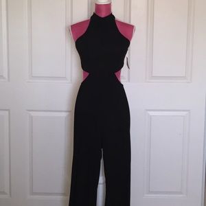 Black Jumpsuit with cut outs. Wide leg fit.