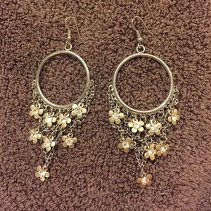 Silver and gold earrings with floral accents