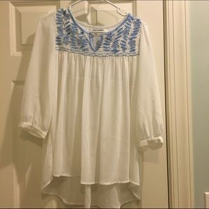 White blouse with sky blue stitching!