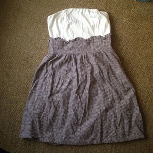 Brown dress with ruffles below the chest area.