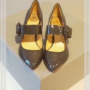 Gunmetal grey patent Clarks Mary Jane heels.