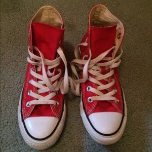 Red, high top converse.