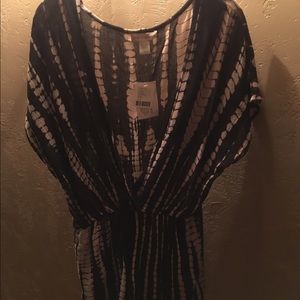 NEW WITH TAGS. Romper