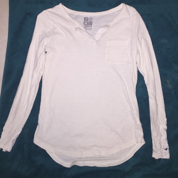 White, long sleeved shirt.