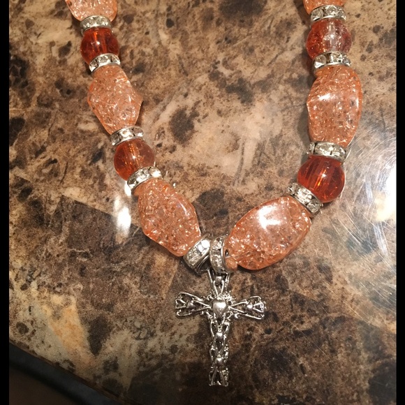 Cross charm bracelet.