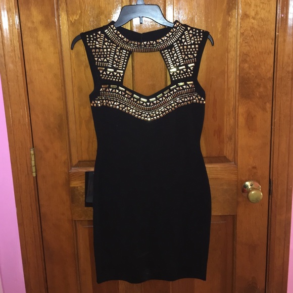 Sleeveless black dress with gold detail