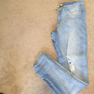 Light wash distressed stretchy skinny jeans