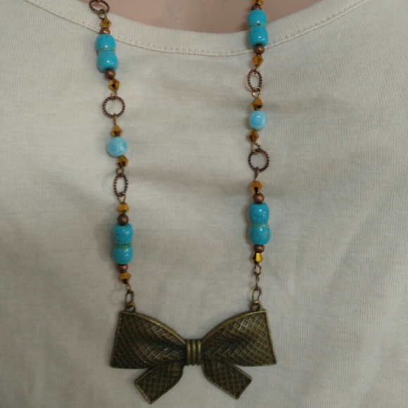 Antique bronze turquoise long bow necklace