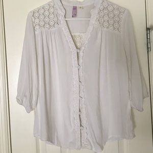 White blouse with floral accents