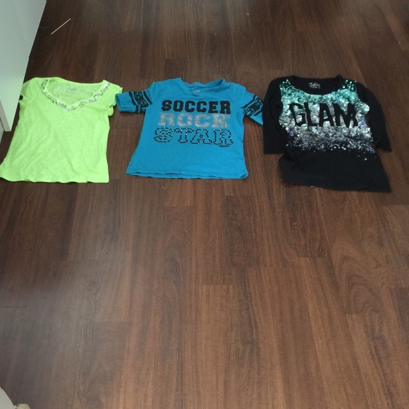 (3) girls gently used Justice shirts, sizes 12-14.