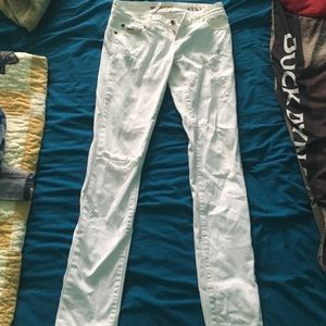 Billabong white skinny jeans.