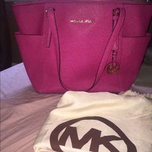 Fuchsia Michael Kors bag with dust bag