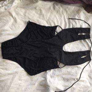 NEVER WORN‼️‼️‼️BLACK ONE PIECE WITH CUTS.