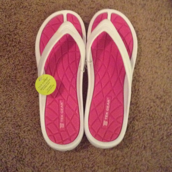 Pink and white flip flops