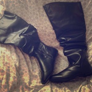 Black knee high boots.