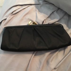 Small black coach clutch
