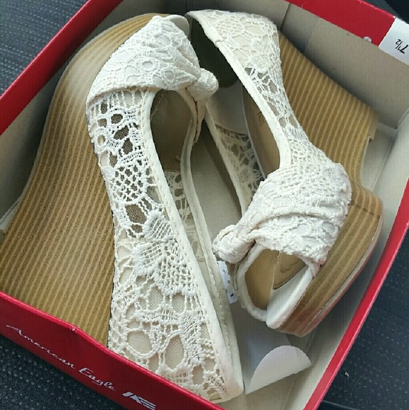 White wedge style shoes