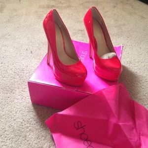 Red patent leather platform heels
