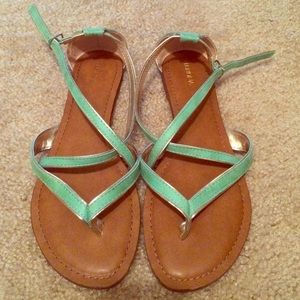 Turquoise flat sandals with silver piping