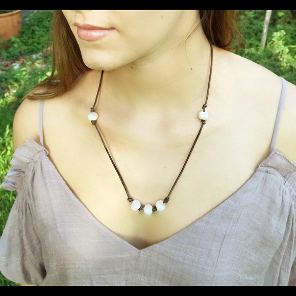 Freshwater pearl on leather