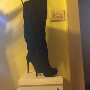 Over the knee high heel boot.