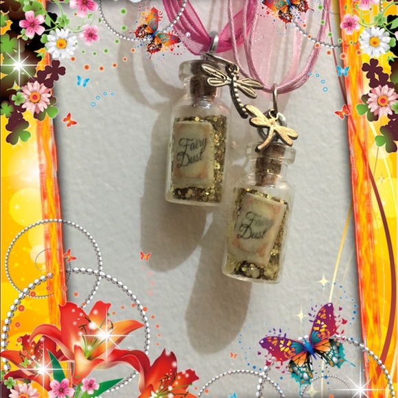 2 adorable bottles of fairy dust with charms