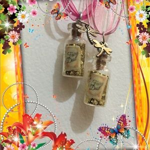 2 adorable bottles of fairy dust with charms