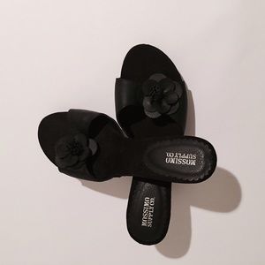 Black heeled sandals.