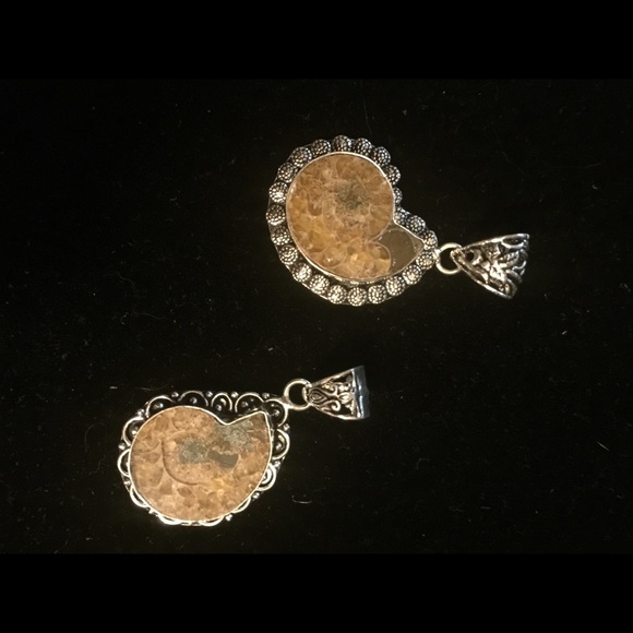 2 fossil , silver pendants