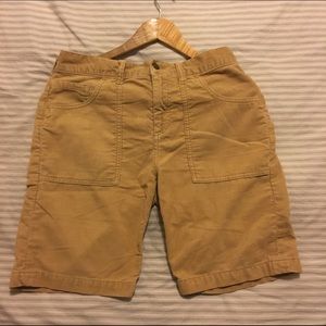 Tan shorts with long seamed pockets