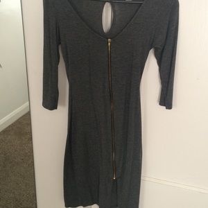 A Dress With Gold Zipper In The Middle.