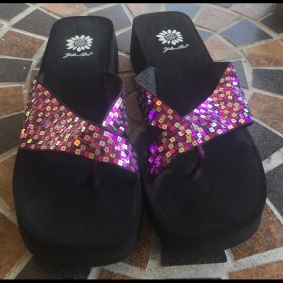 Yellow Box pink and purple flip flops.