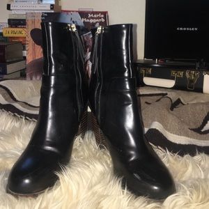 Black booties with wool detailed heel.